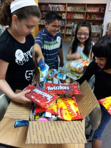 Third Grade students at Woodbury helped pack up seven Woodbury Cares packages to the service men and women in the platoon of their teacher, Petty Officer Richard Ortega, who is serving in Afghanistan.