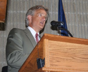 David Tank, grandson of Martha-Ellen Tye and vice president of the Martha-Ellen Tye Foundation, announces a $1 million grant toward the Roundhouse renovation at an event Tuesday evening.