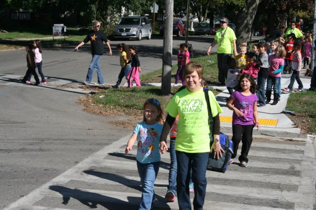 Students and staff from Rogers Elementary walk to the National Guard Armory on Monday as part of the Healthiest State Initiative. 