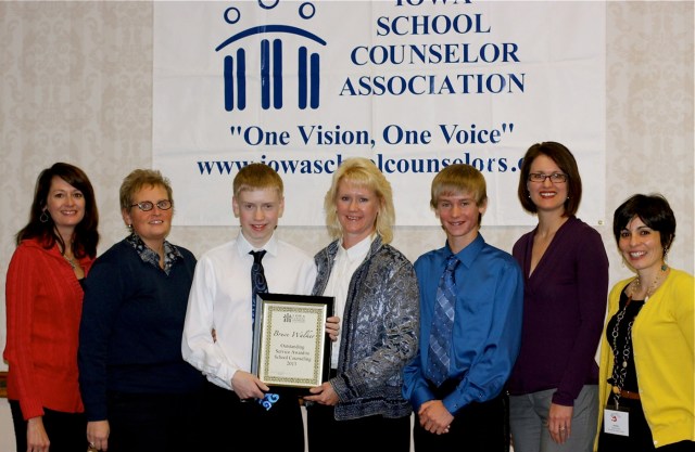 Members of the Walker family and counselors from Marshalltown Schools accept the 2013 Outstanding Service Award on behalf of the late Bruce Walker.
