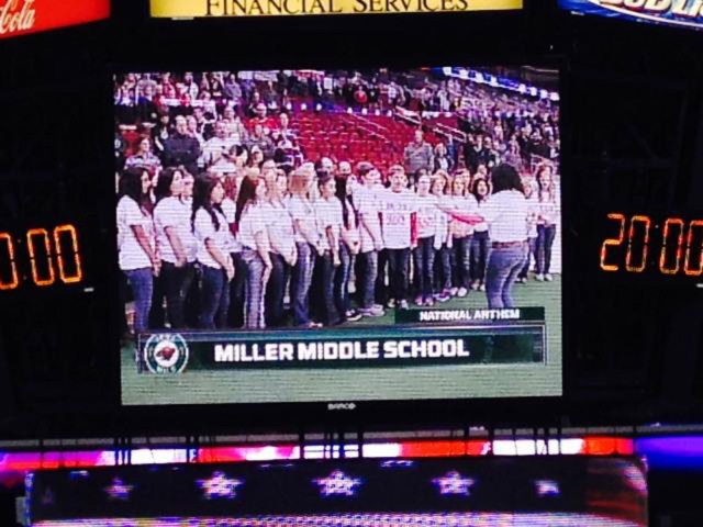 Miller Middle School students sing the National Anthem at the Iowa Wild Hockey game Sunday, Nov. 3, in Wells Fargo Arena, Des Moines.