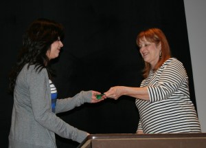 MHS senior Paola Diaz receives the Best in Show: 3D Artwork award at the CIML Art Show held Wednesday, April 9, at Marshalltown High School.