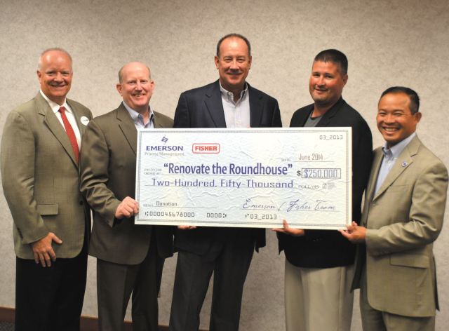 T-R PHOTO BY ANDREW POTTER Emerson/Fisher has announced it will donate $250,000 to the Marshalltown High School Roundhouse renovation. Pictured are from left, Paul Gregoire of Emerson/Fisher, Gary Schaudt, co-chair of Roundhouse fundraising, Terry Buzbee of Emerson/Fisher and Craig Huegel and Aiddy Phomvisay of MHS.